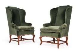 A PAIR OF WALNUT AND UPHOLSTERED WING ARMCHAIRS, IN WILLIAM & MARY STYLE