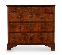 A GEORGE I WALNUT CHEST OF DRAWERS, CIRCA 1720