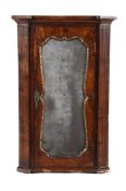 A GEORGE II FIGURED WALNUT, FEATHER BANDED AND PARCEL GILT HANGING CORNER CUPBOARD, CIRCA 1740