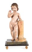 A POLYCHROME AND GILT PAINTED SOFTWOOD FIGURE OF A CHILD BEARING AN APPLE, ITALIAN OR SPANISH