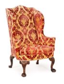 A GEORGE II MAHOGANY AND UPHOLSTERED WING ARMCHAIR, CIRCA 1740