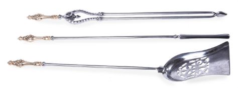 A SET OF VICTORIAN STEEL AND BRASS HANDLED FIRE TOOLS, MID 19TH CENTURY