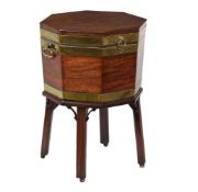 A GEORGE III MAHOGANY AND BRASS BOUND OCTAGONAL CELLARETTE, CIRCA 1780