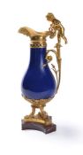 A LOUIS XVI BLUE GROUND PARIS PORCELAIN AND ORMOLU AND MARBLE MOUNTED EWER, CIRCA 1785
