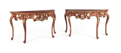 A PAIR OF CONTINENTAL RED PAINTED AND PARCEL GILT CONSOLE TABLES, SECOND HALF 18TH CENTURY