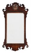 A GEORGE II WALNUT AND PARCEL GILT WALL MIRROR, CIRCA 1755