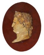 AN ITALIAN GIALLO ANTICO OVAL RELIEF PORTRAIT OF THE ROMAN EMPEROR VESPASIAN, LATE 19TH CENTURY