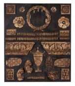 A MOUNTED BOARD OF PLASTER FRAGMENTS, EARLY 20TH CENTURY