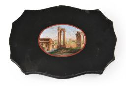 AN ITALIAN MICROMOSAIC PAPERWEIGHT DEPICTING THE ROMAN FORUM WITH THE TEMPLE OF CASTOR AND POLLUX