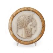 A WHITE MARBLE ROUNDEL DEPICTING THE HEADS OF JUPITER AND JUNO IN RELIEF