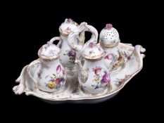 A Dresden oil and vinegar set on stand