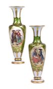 A pair of Bohemian green glass and white overlay vases