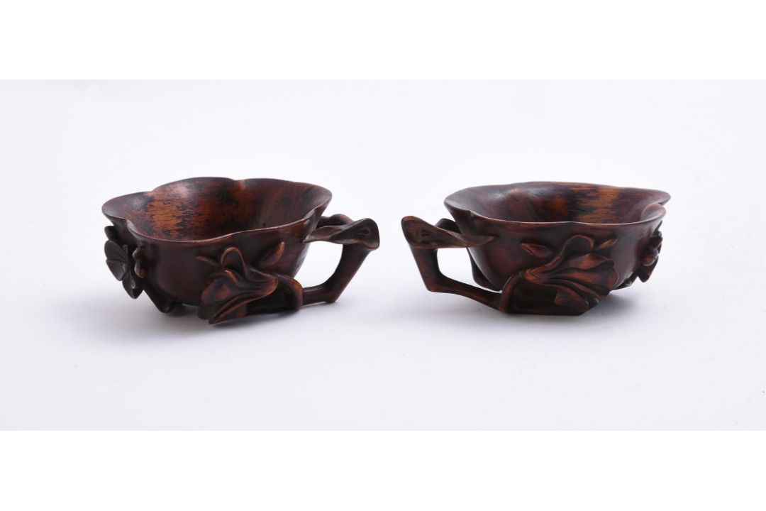 A pair of Chinese Huanghuali 'prunus and lotus' cups - Image 2 of 4