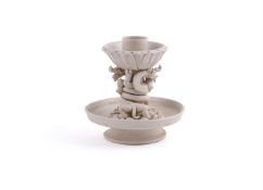 A Chinese white glazed candle holder