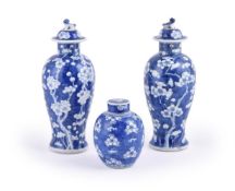 A pair of Chinese blue and white vases and covers