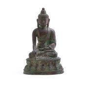 A Tibetan bronze figure of Buddha