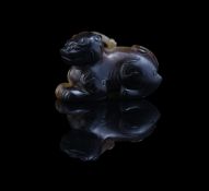 A Chinese celadon and brown jade model of a bixie