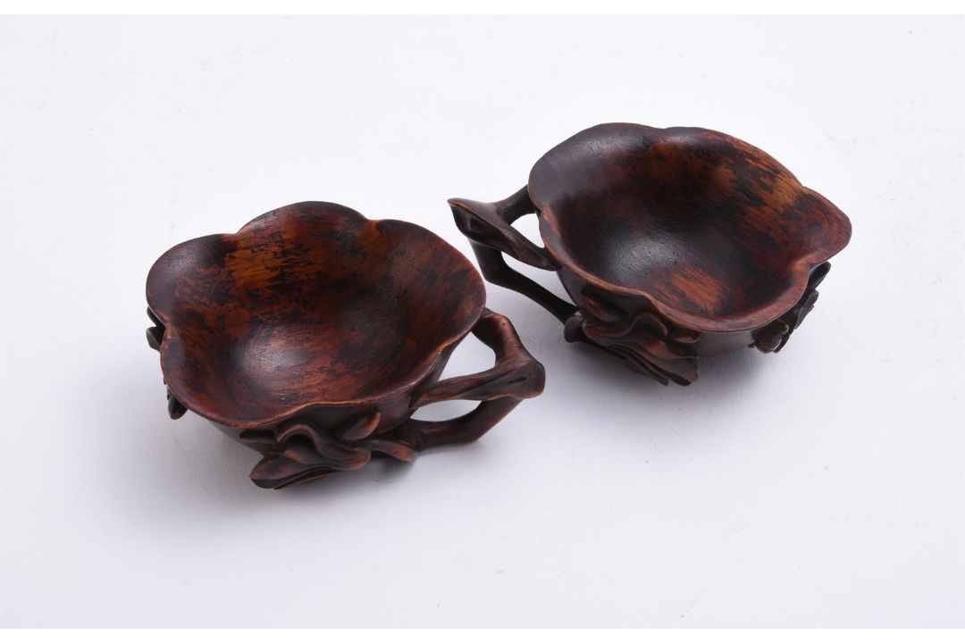 A pair of Chinese Huanghuali 'prunus and lotus' cups - Image 3 of 4