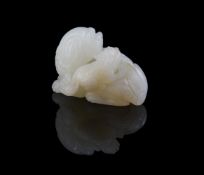A Chinese white jade carving of a Buddhistic lion and cub