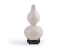 A Chinese white glazed double gourd vase