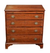 A mahogany and inlaid chest of drawers
