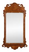 A George II walnut and parcel gilt composition wall mirror