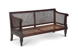A REGENCY MAHOGANY AND CANED BERGÈRE SETTEE, IN THE MANNER OF WILLIAM TROTTER, CIRCA 1815