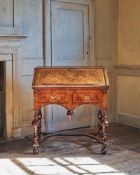 A DOUBLE-SIDED FIGURED WALNUT AND FEATHER BANDED BUREAU ON STAND, CIRCA 1690 AND LATER
