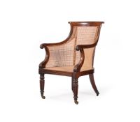A REGENCY MAHOGANY BERGERE LIBRARY ARMCHAIR, CIRCA 1825
