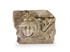A CARVED STONE FRAGMENT OF A FEMALE FACE, ENGLISH LATE 17TH CENTURY