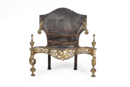 A BRASS AND STEEL SERPENTINE FIREGRATE, IN GEORGE III STYLE
