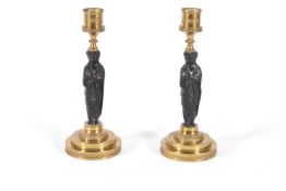 A PAIR OF FRENCH BRONZE AND ORMOLU CANDLESTICKS, PROBABLY THIRD QUARTER 19TH CENTURY