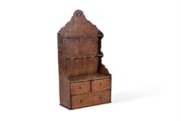 A GEORGE II OAK SPOON RACK, CIRCA 1750
