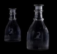 A PAIR OF REGENCY CRESTED GLASS SERVING BOTTLES, CIRCA 1820