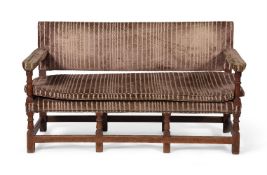 AN ARTS & CRAFTS OAK AND UPHOLSTERED SOFA, CIRCA 1890