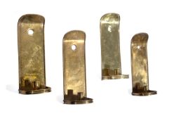 A SET OF FOUR EMBOSSED SHEET BRASS WALL SCONCES, 18TH CENTURY