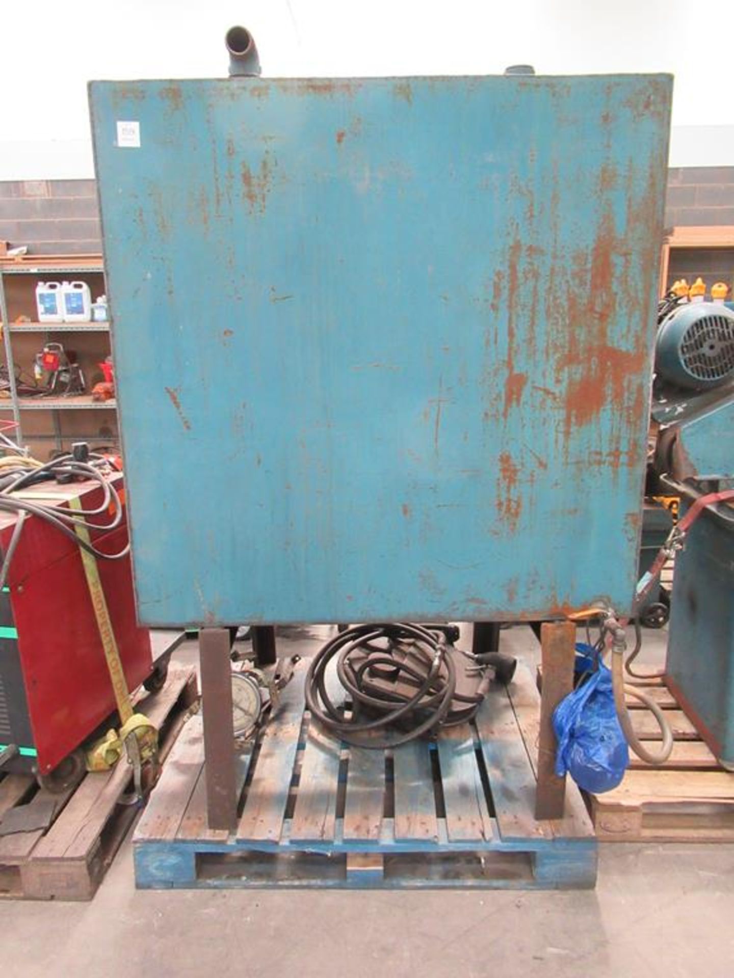 Steel oil tank on stand with fuel pump and hose reel