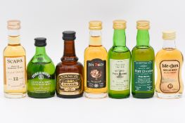 Twelve assorted single Islay and Lowland malt whiskies, mostly 1980s/90s bottlings