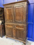 17th cent. Style oak cupboard with foliate carved stiles and inlaid bottom section, with stile feet.