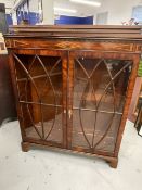 19th cent. Figured mahogany glazed display cabinet, inlaid with a geometric design. 43½ins. x 13ins.