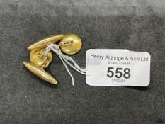 Yellow metal chain cufflinks, one end having a white enamelled button, the other end with a