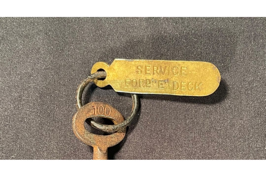 R.M.S. TITANIC: White Star Line company key and ring with brass tag stamped "SERVICE FORd "E" Deck". - Image 2 of 2
