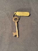 R.M.S. TITANIC: White Star Line company key and ring with brass tag stamped 