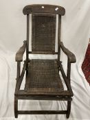 OCEAN LINER: Early 20th Century Anchor Line steamer deck chair with cane seat and with its