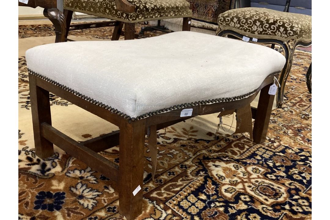 19th cent. Oak serpentine front footstool, lined, seated webbing and stuffing require restoration.