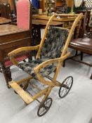 Early 20th cent. Beech framed children's pushchair.