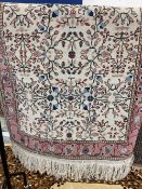Carpets & Rugs: 20th cent. Kazak brown ground, four guls with geometric design, sixteen borders.