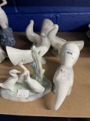 Nao: Four dove figures. Approx. 6ins. - 8ins. Long. Plus a group of geese. (5)