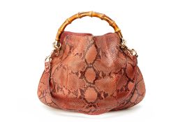 A GUCCI PYTHON BAG WITH BAMBOO HANDLE