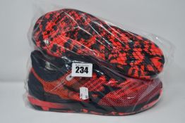 One as new Mizuno TC-11 red trainers size UK 8.